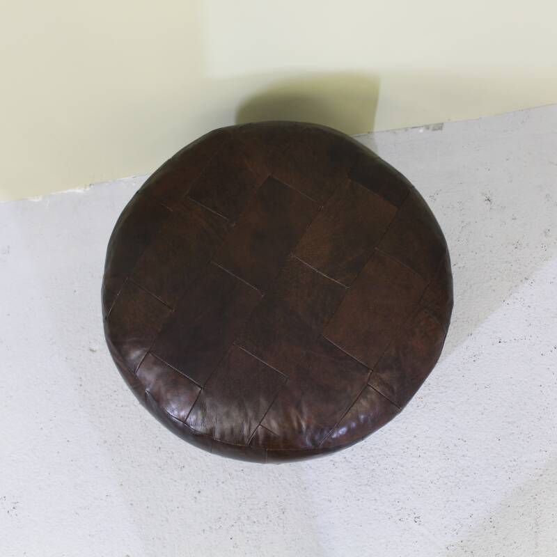 Vintage poef bruin leer